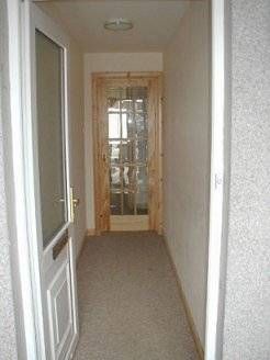 Front doors lead into an Entrance Hall with inner 15 pane glass door.